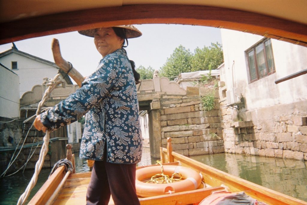 On a rowing boat on canal in China